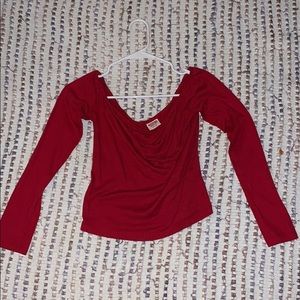 Red low shoulder long sleeved top.